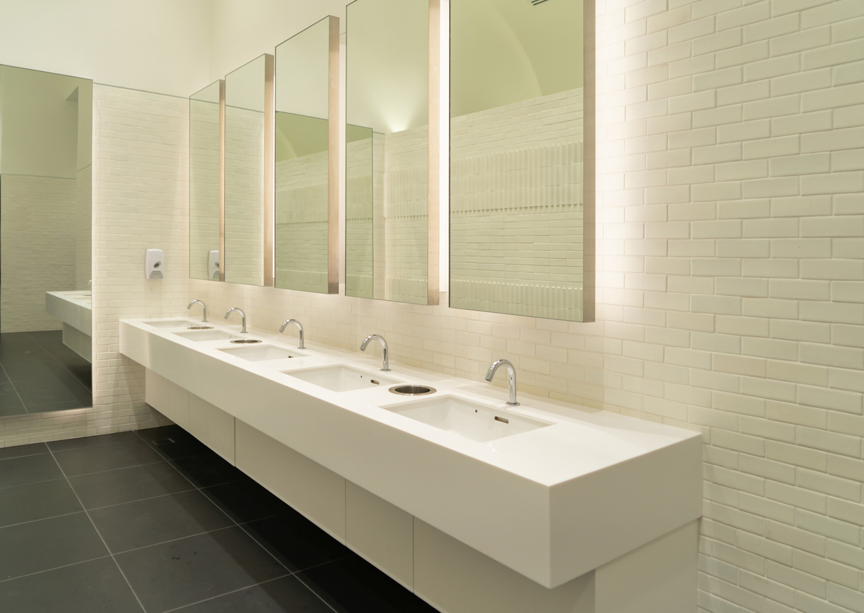 Row of white modern marble ceramic wash basin in public toilet, restroom in restaurant or hotel or shopping mall, interior decoration design commercial plumbing, western mass, row of bathroom sinks